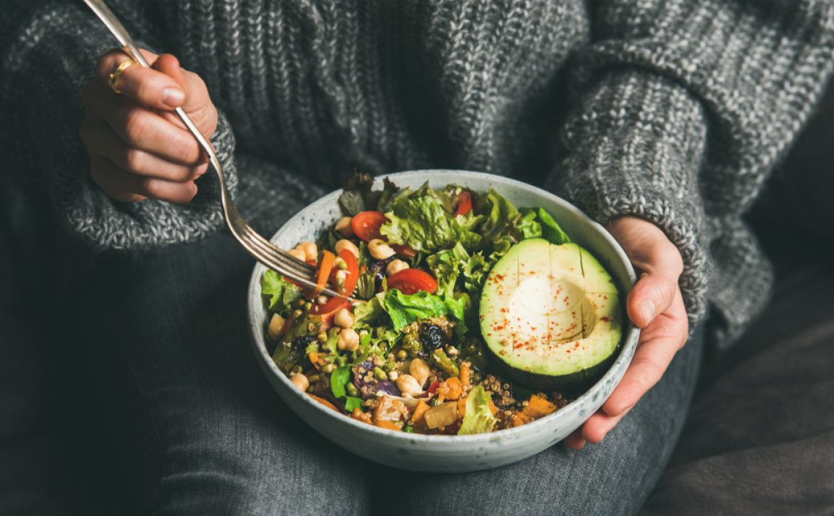 Healthy,Vegetarian,Dinner.,Woman,In,Jeans,And,Warm,Sweater,Holding